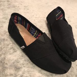 Toms black slip on shoes